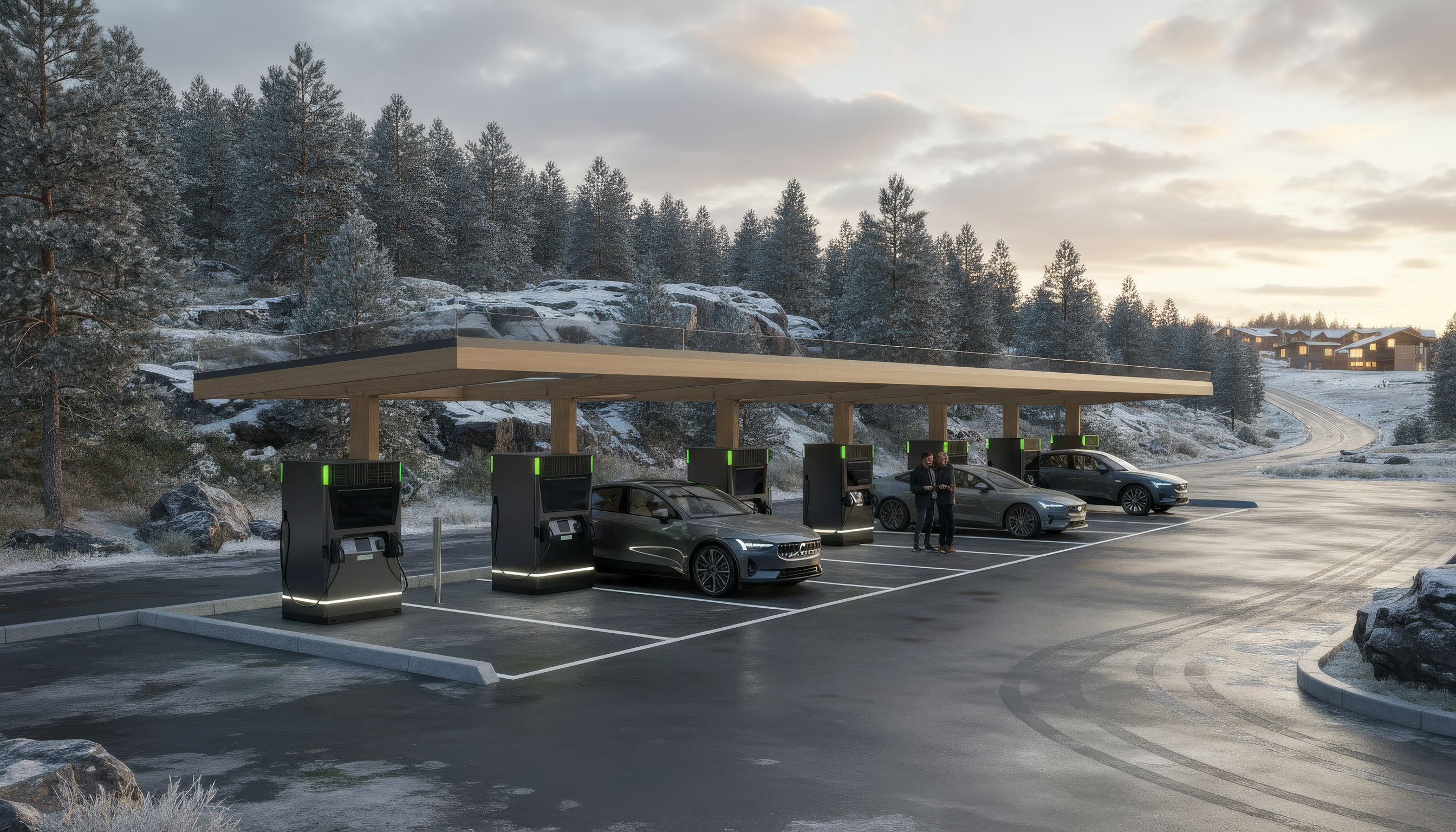 Bilar vid laddstation på vinter